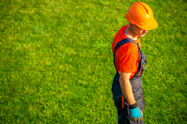 man repairing grass